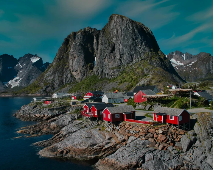 small red cottages with mountains in background