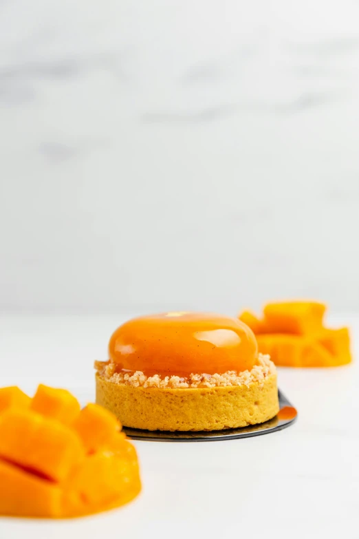 four pieces of orange cake on a plate