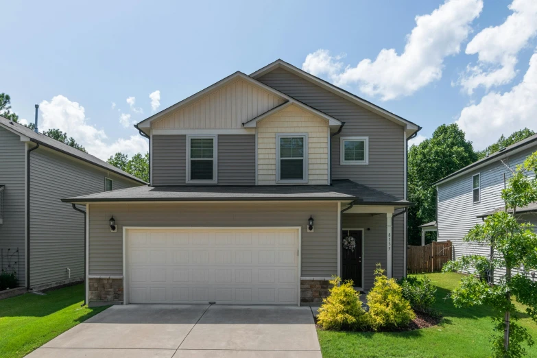 a single house with a large driveway is shown