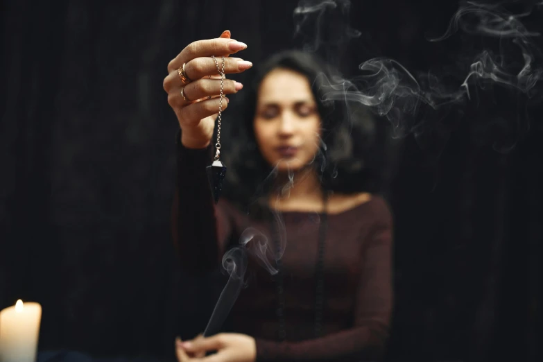 a woman smoking on an electronic cigarette