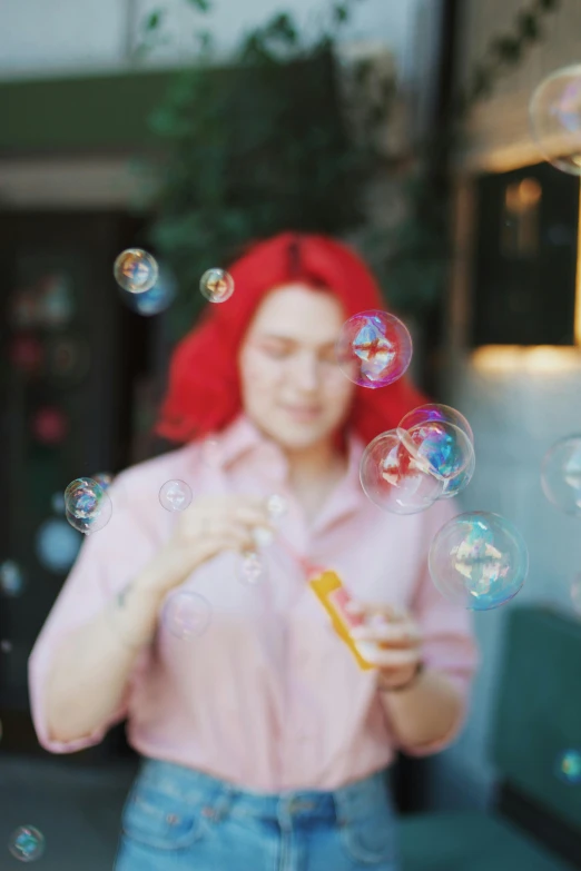 the woman is blowing soap bubbles in the air