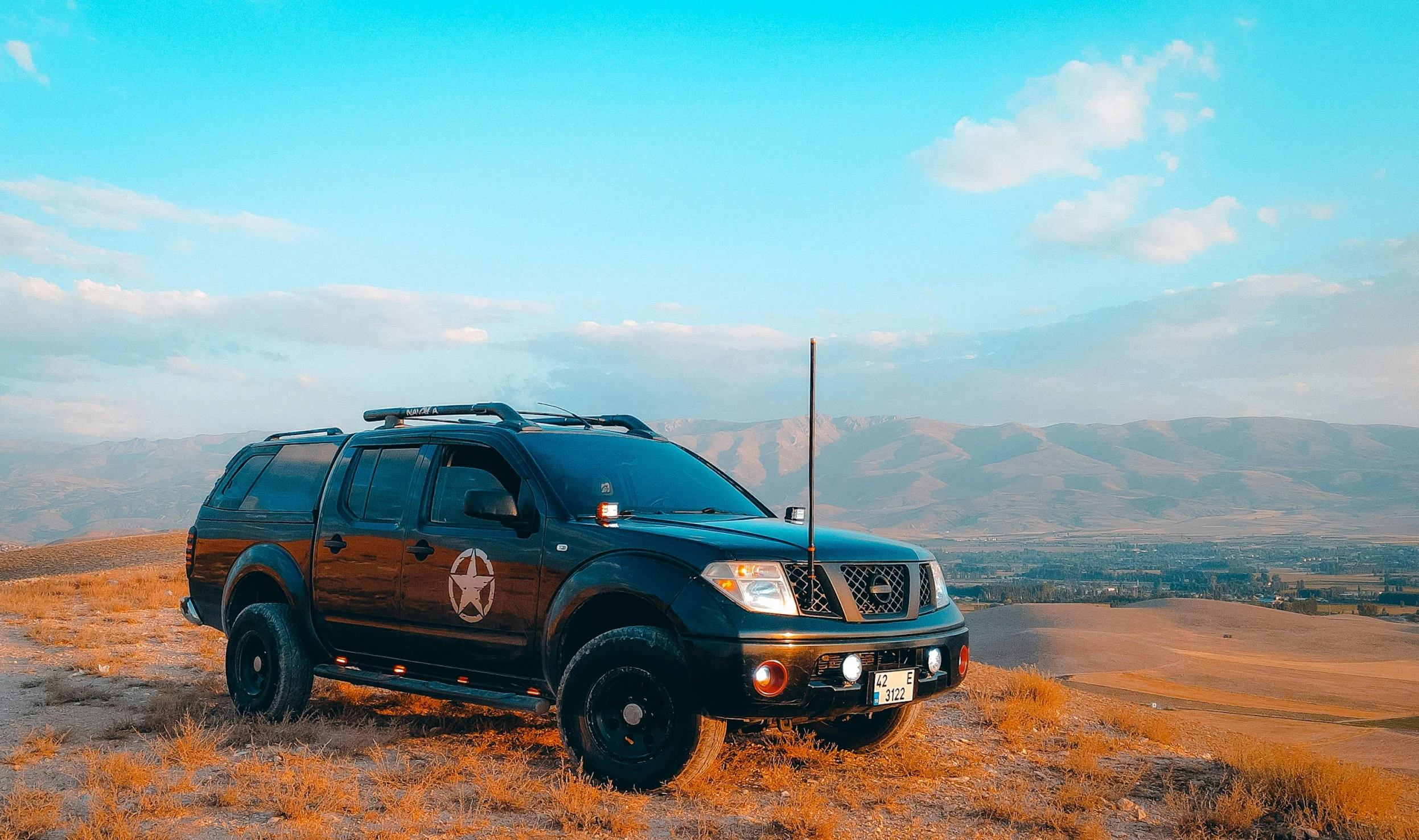 a car parked on the side of a hill