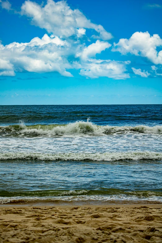 a person riding a wave on the beach