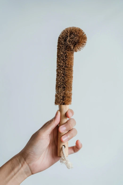 a person is holding a tooth brush on top of their hand