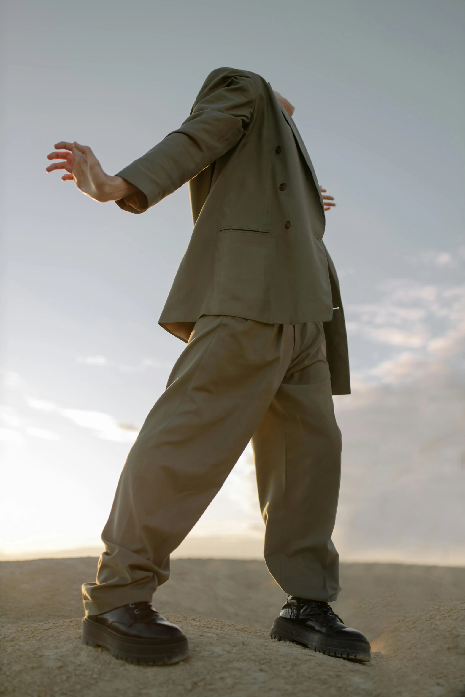 a man in a suit posing for a picture