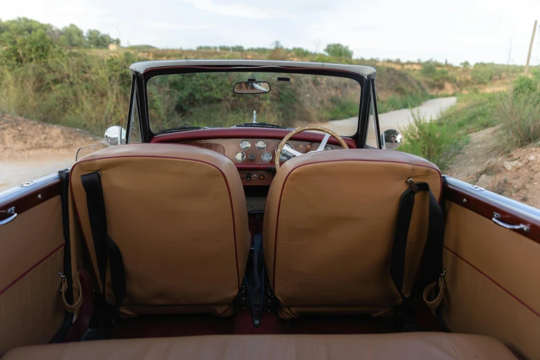 the back of a classic convertible looking convertible car