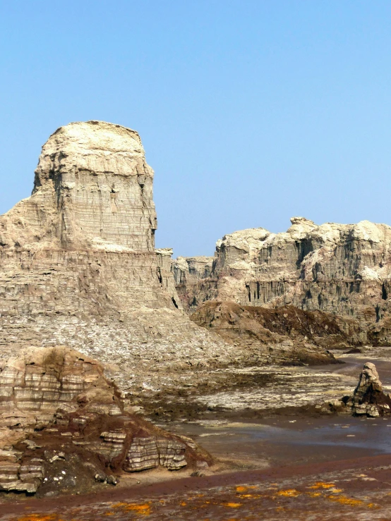 a couple of rock towers sitting on top of a hill