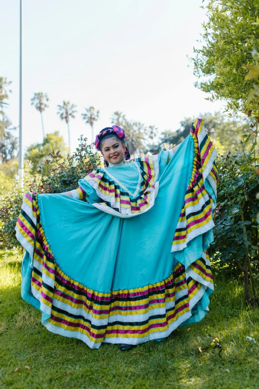 woman with an open skirt sitting in the grass