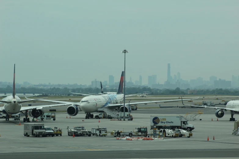 several jumbo jets are lined up on a runway