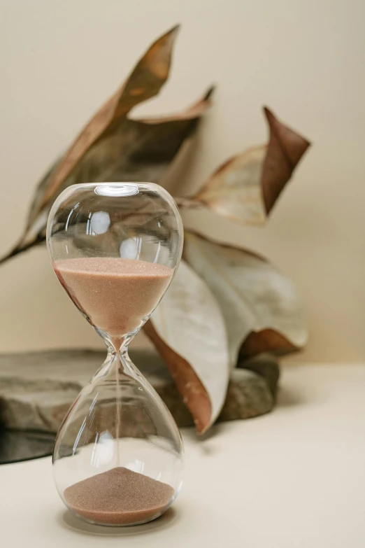 a sand clock sitting on top of a table