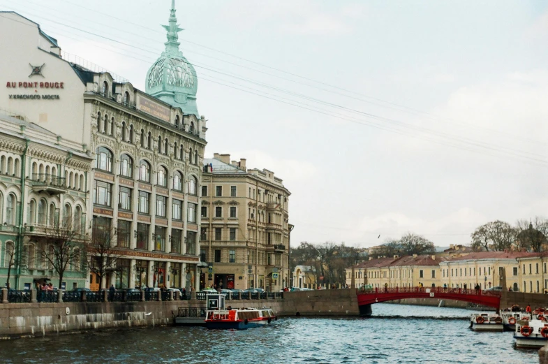 a river running through a city with several large buildings