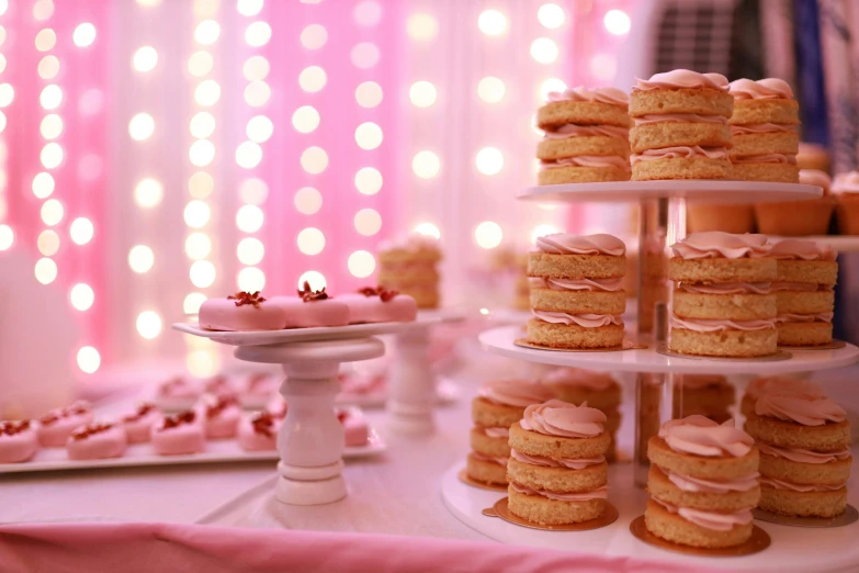 several deserts are arranged on a cake stand