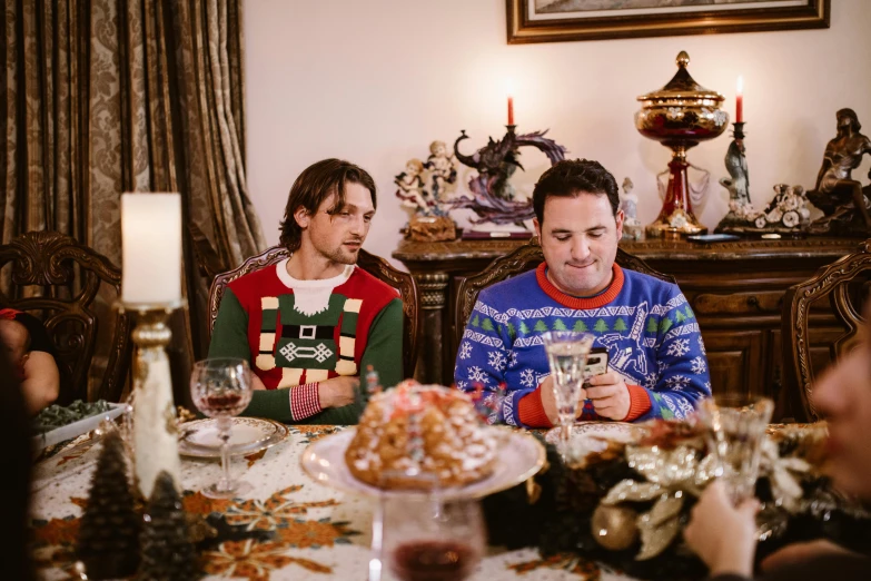 two people sitting at a dinner table together