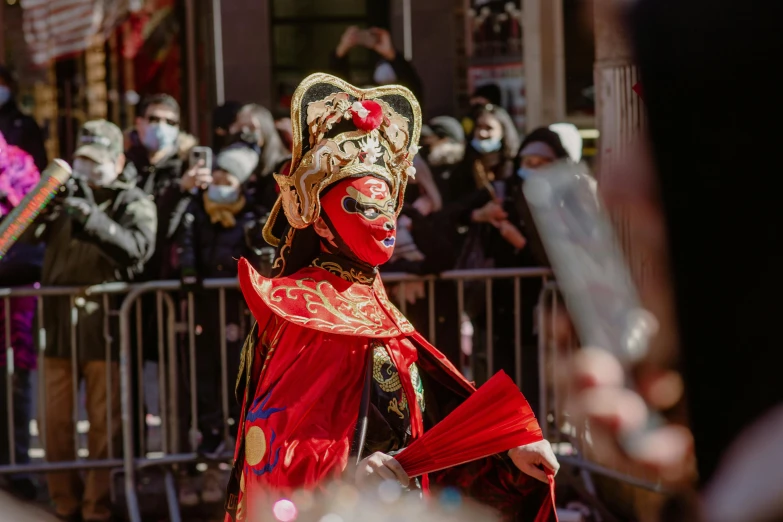 the woman is dressed up as a masked figure