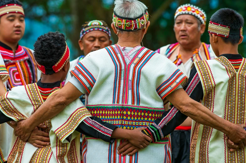 some men in different colorful outfits with no one wearing a crown