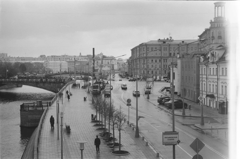 old fashion cars on a rainy day along a river