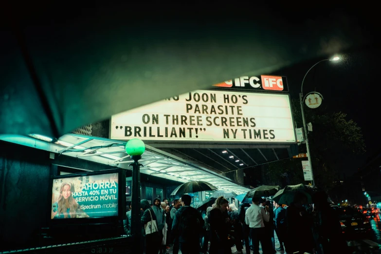 people are lined up outside of a theater