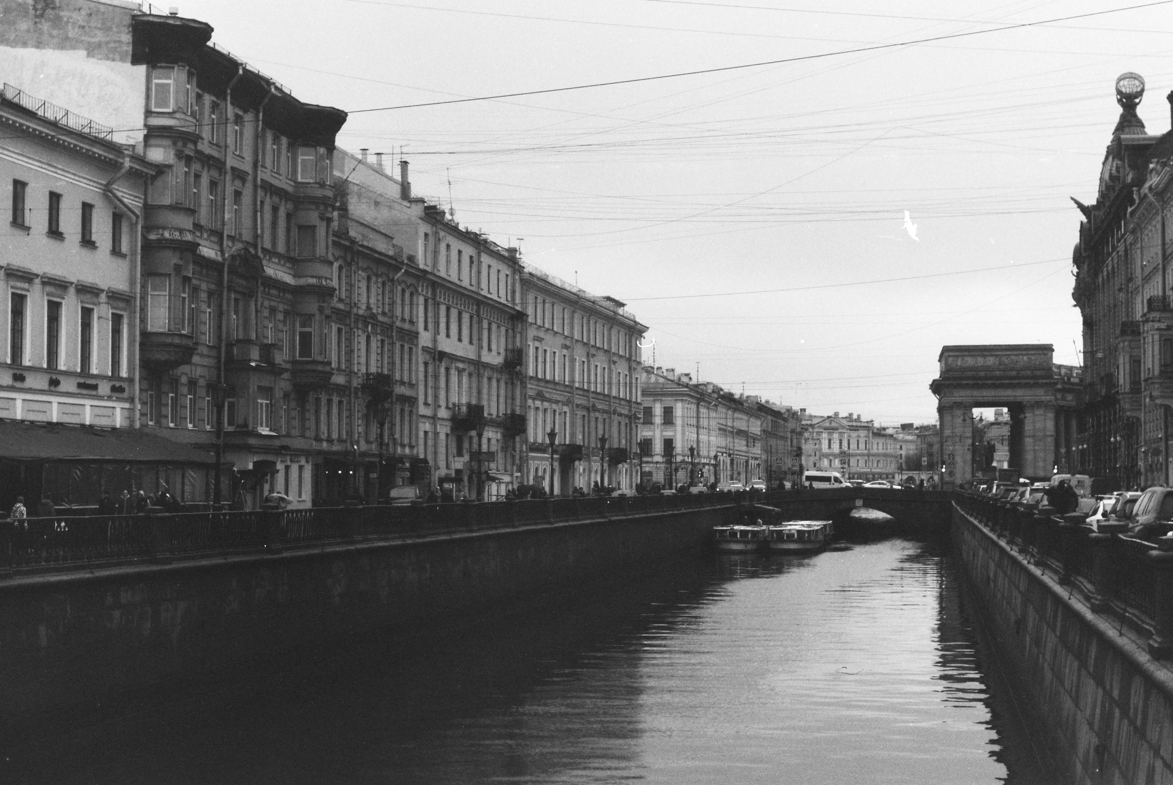 a street lined with buildings next to water