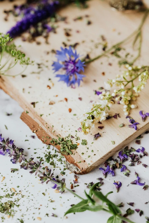 a close up of lavender flowers on a  board