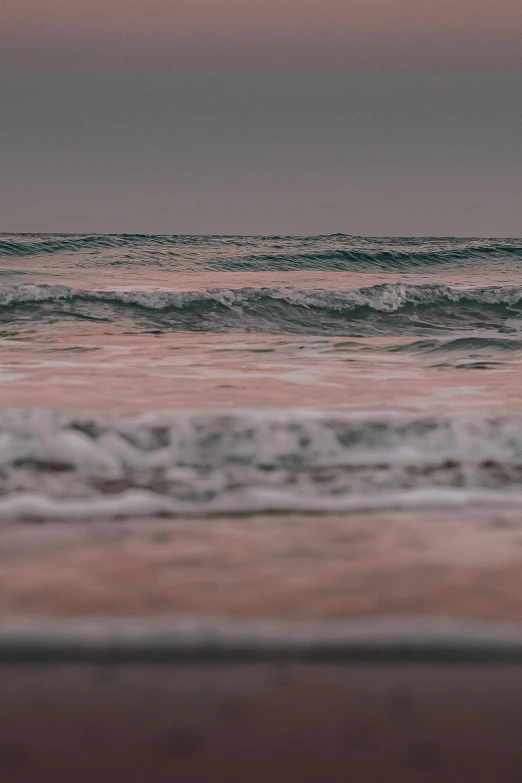 a person riding a surfboard in the waves