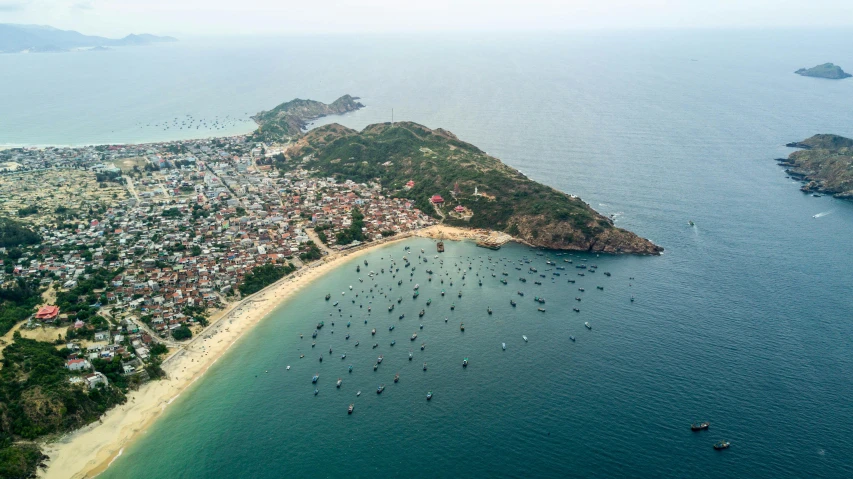 the city is perched on the island overlooking the blue water