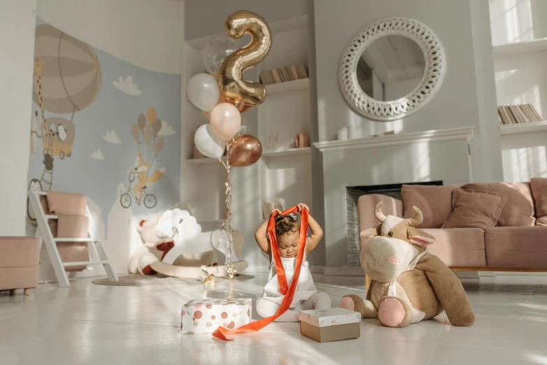 stuffed animals in a living room with balloons