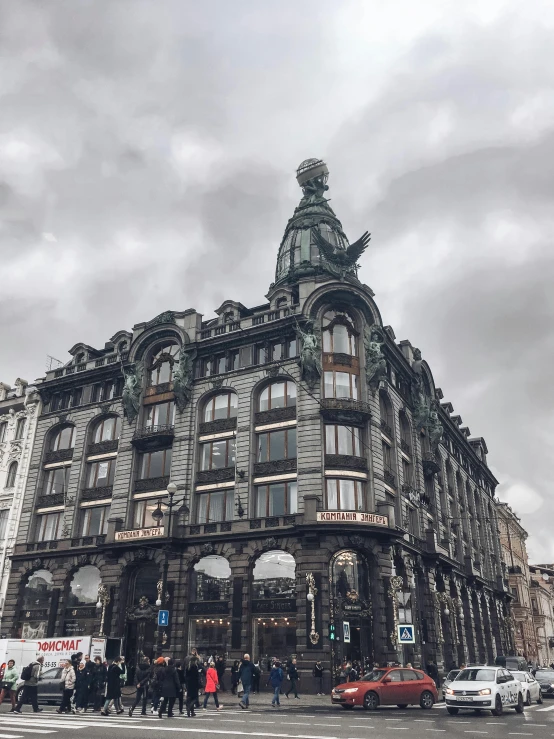 an old building sitting in the middle of a road