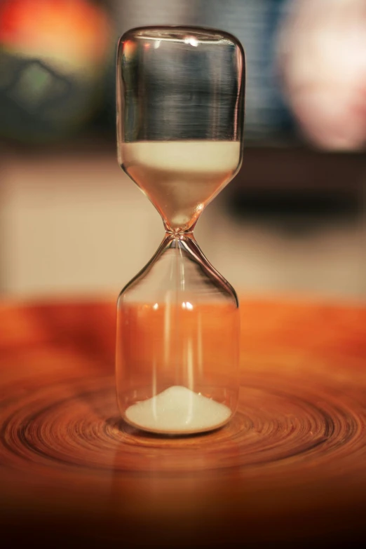 a hour - glass in which one is turning through the sand