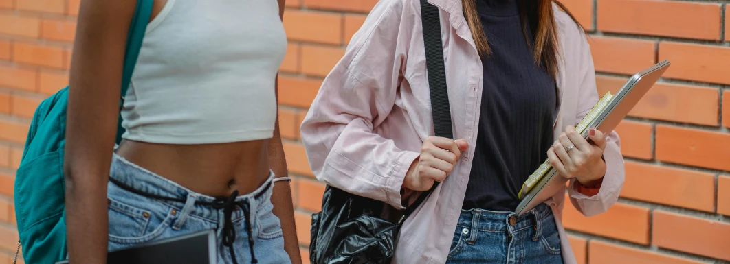 two women with purses on the street