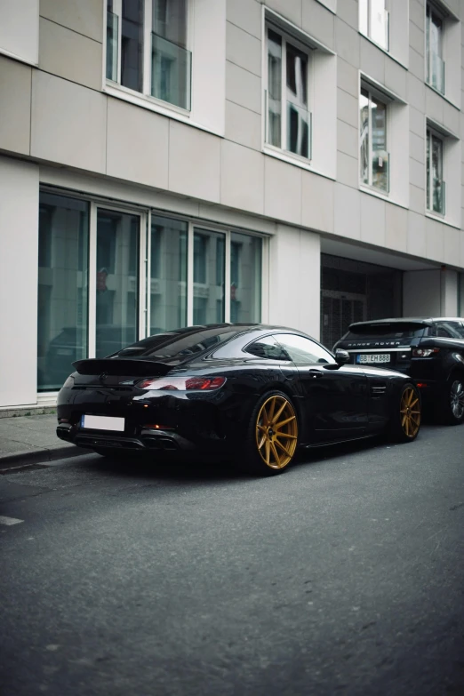 a car parked on the side of a road in front of a building