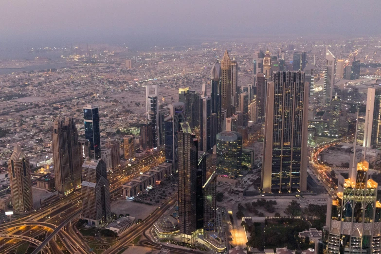 a city is shown with many skyscrs at night