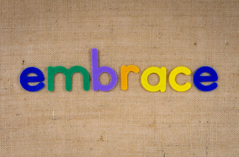 an emce spelled with letters in different colors