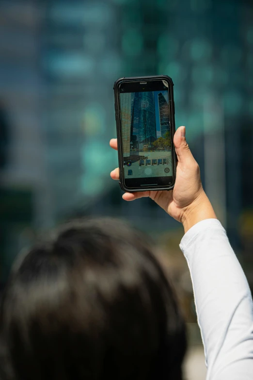 person using his cell phone while in the street