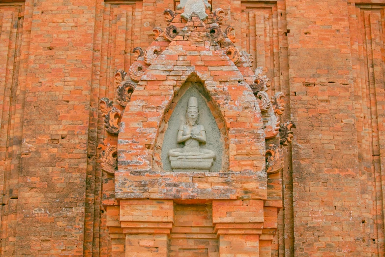 a decorative stone work on the side of a building