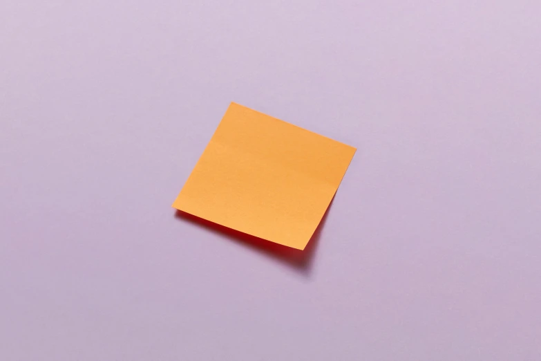 an orange piece of paper with some corner removed