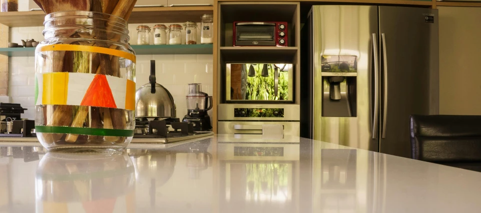 an open jar is on the counter near a chair