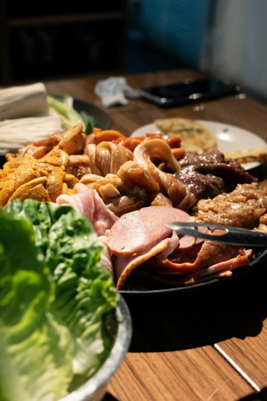 a bowl of meat on a table top