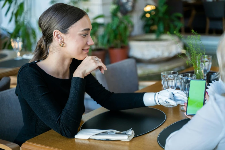 two women at a table having lunch and conversation