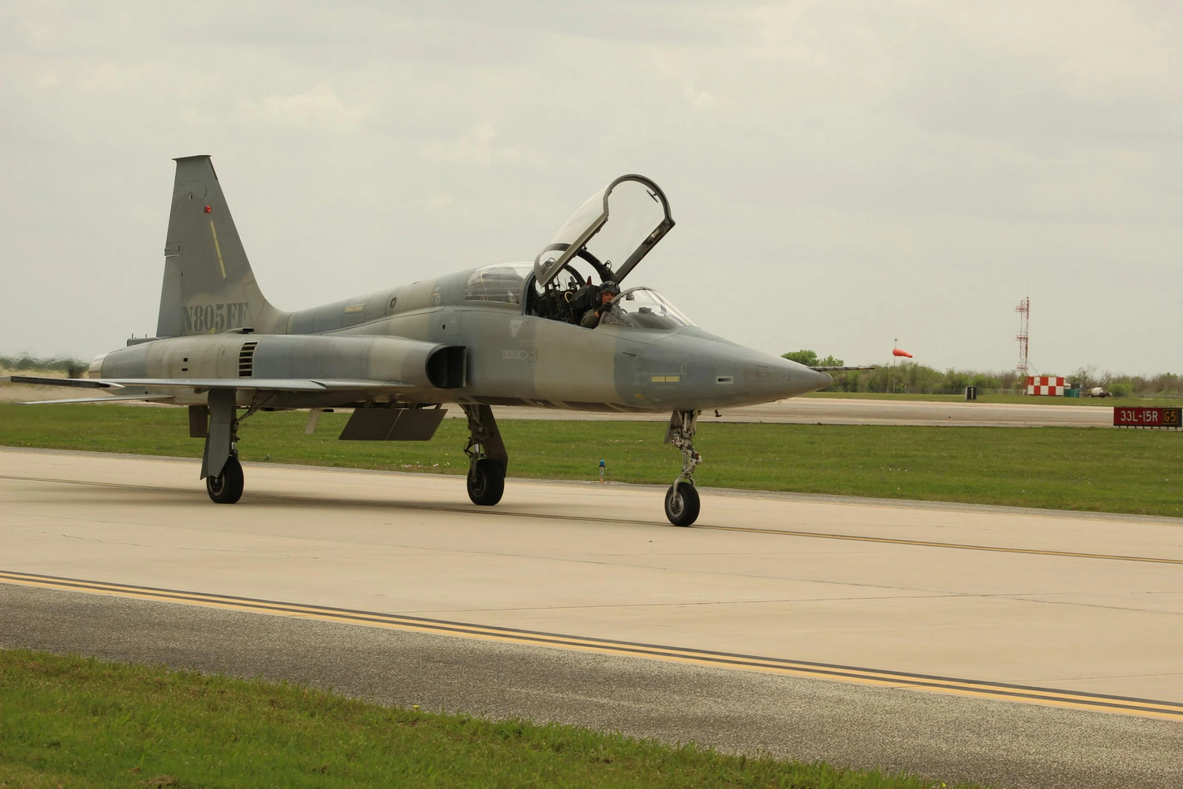 a jet is parked and on the runway