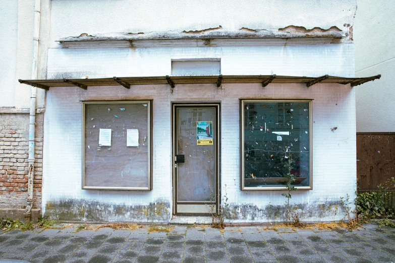 an old door is open on an empty street