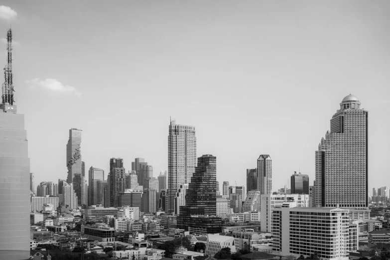 the cityscape has tall skyscrs that are high up in the air