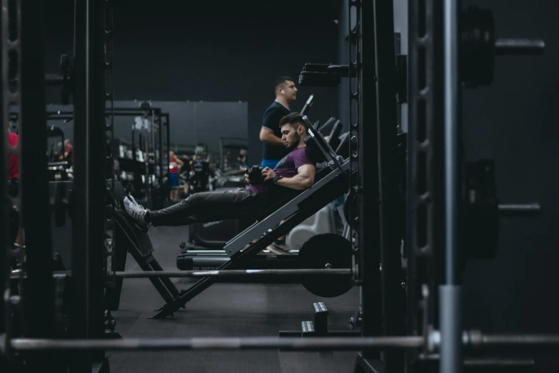 two people exercising at a gym together