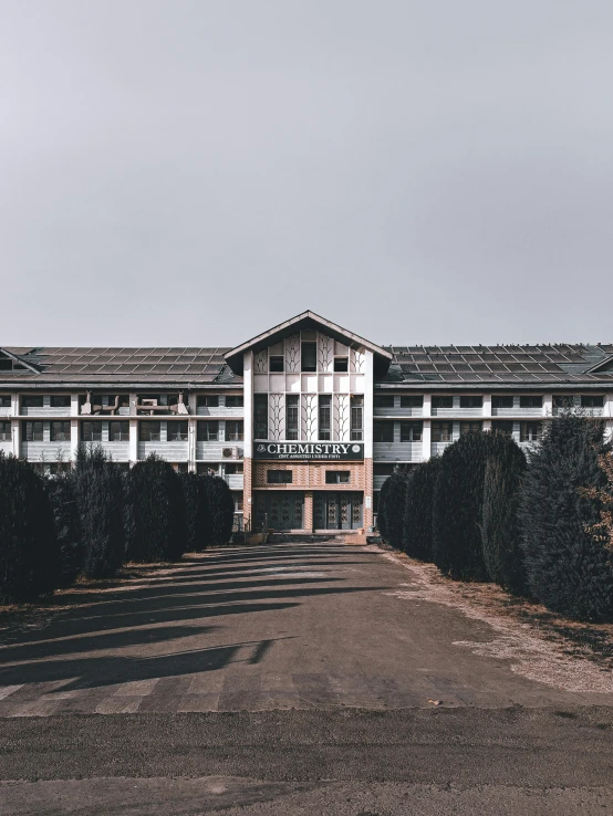 the building is white in color and on the street