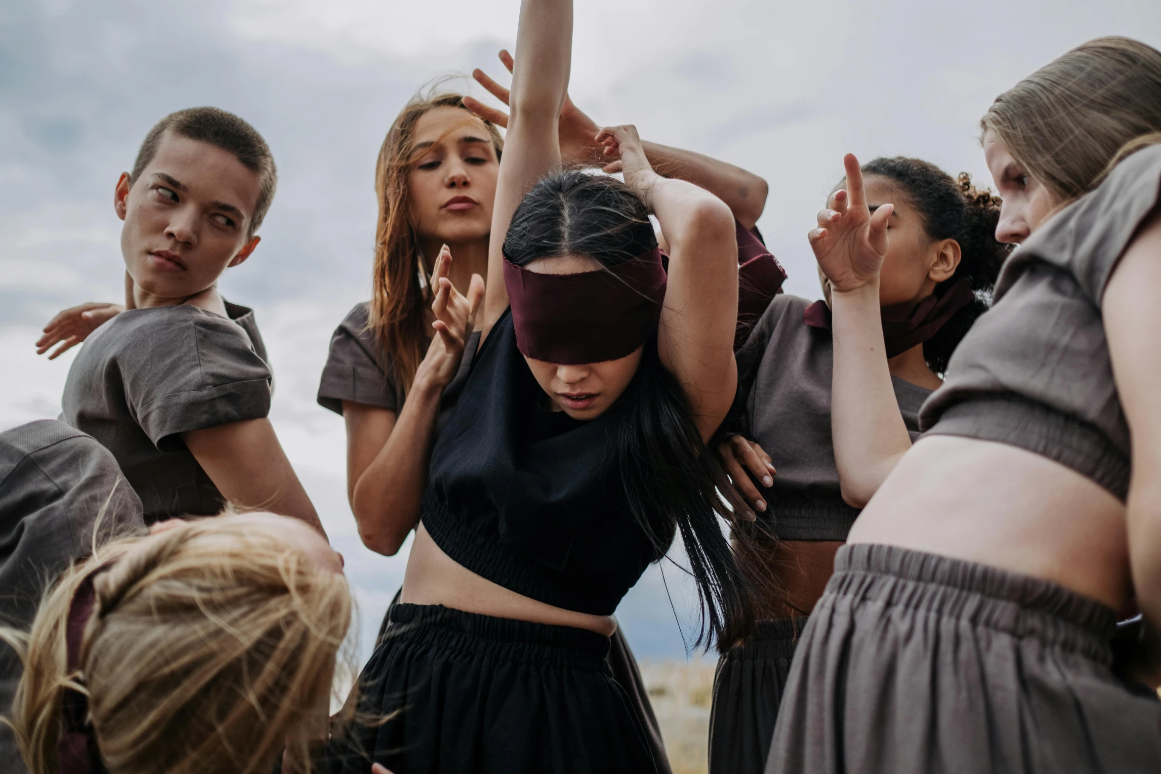 a group of women standing around each other in the air