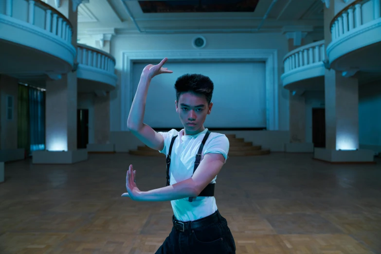 a man wearing suspenders and a white shirt