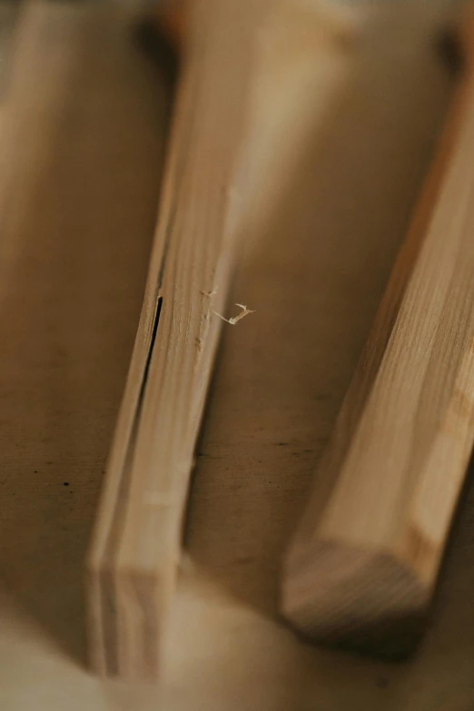 four wood utensils sit on a table