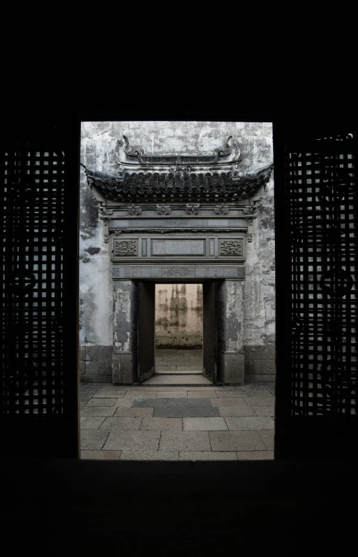 an old gate is shown in black and white