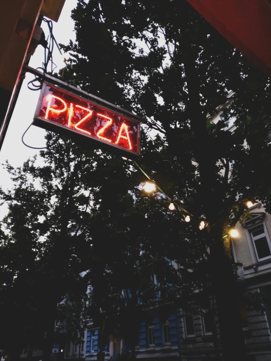 a restaurant sign with neon lit up the bottom