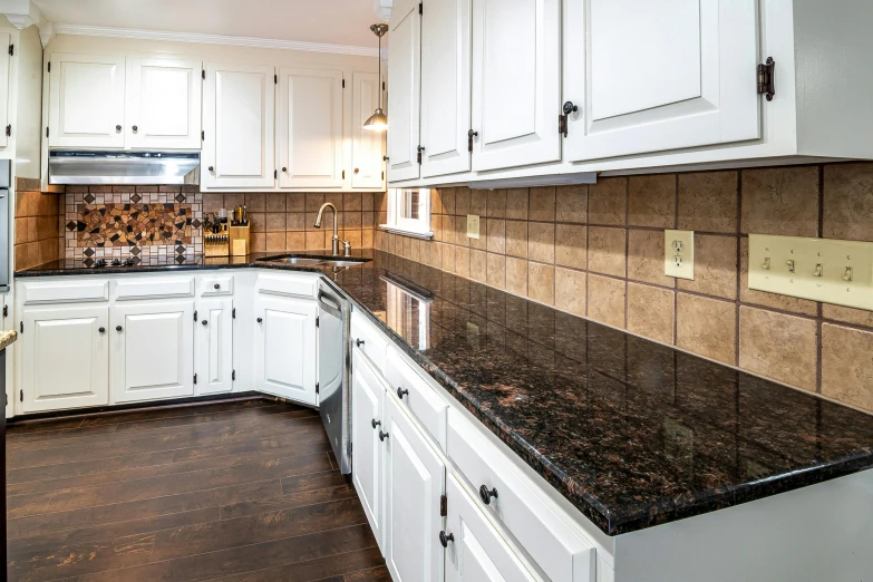 a kitchen with an all white center island