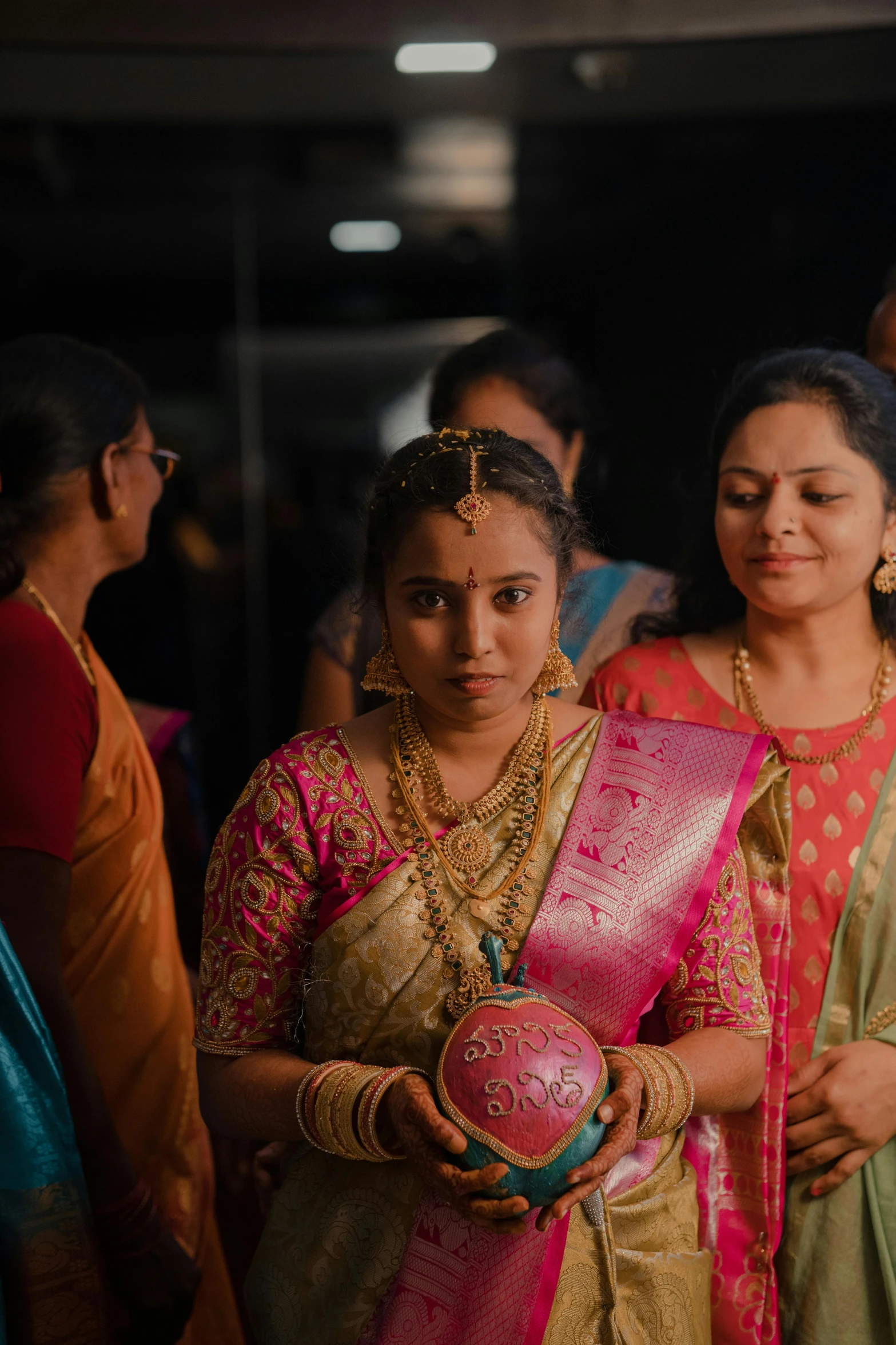 the brides are dressed in their respective traditional attire